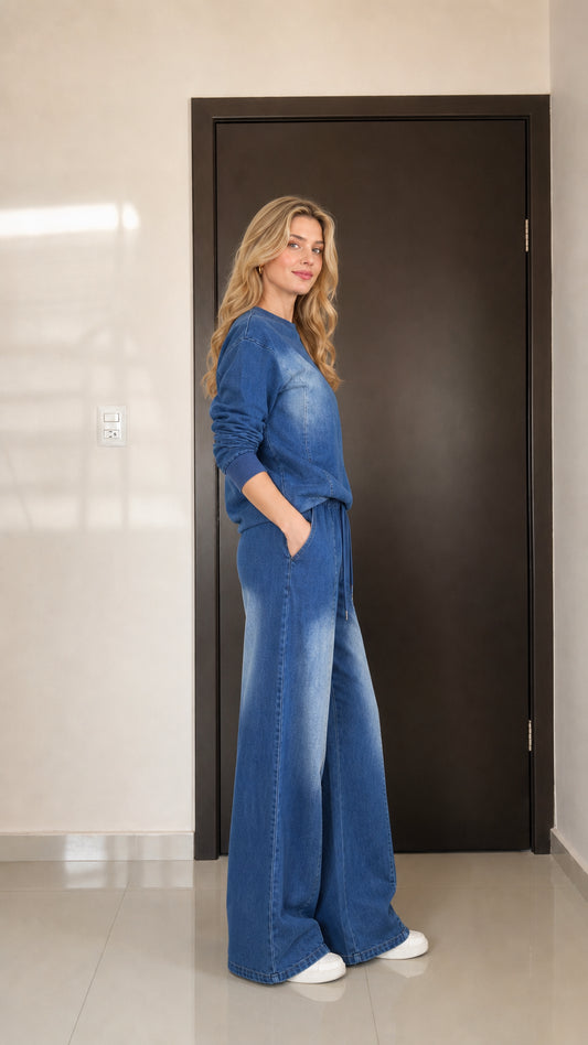 Side 3/4 view of model showing the relaxed drape of the Denim Blue matching loungewear set
