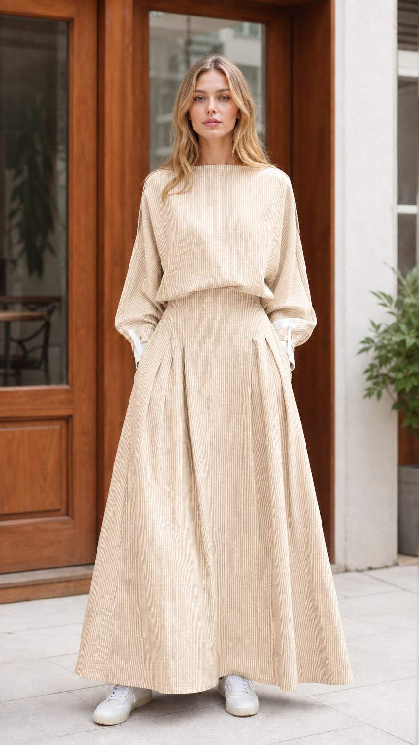 Model wearing beige striped pleated waist maxi dress