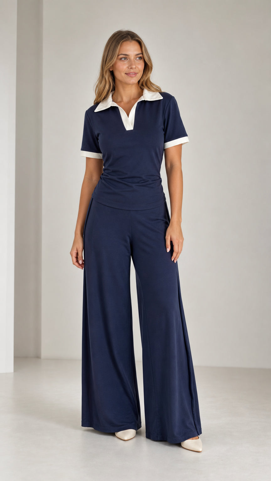 Front view of model wearing Navy Blue contrast collar polo top and wide leg pants set