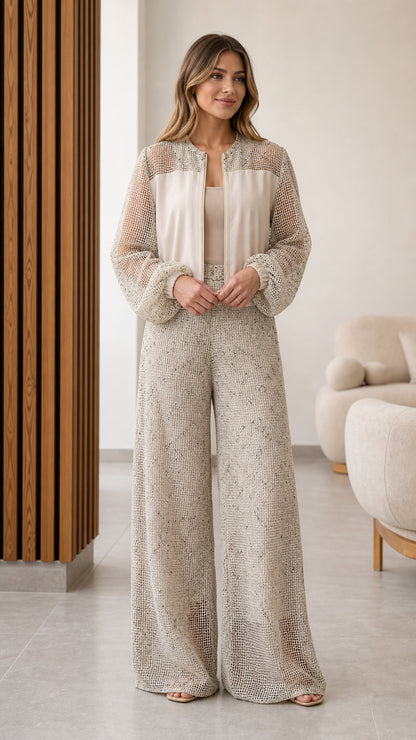 Model wearing beige textured mesh panel zip jacket and wide leg pants set front view