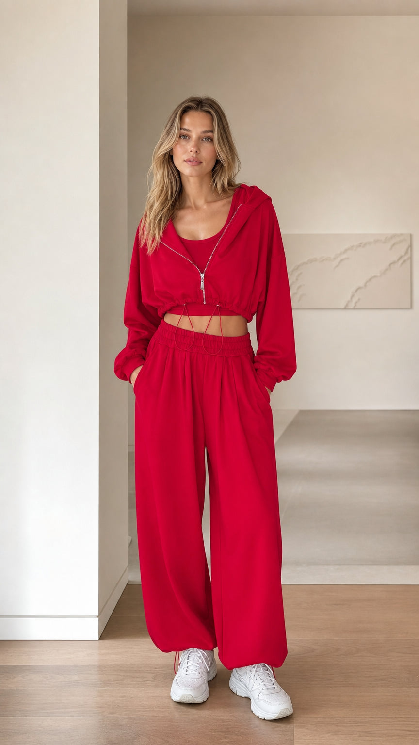 Front full view of woman wearing red 3-piece cropped hoodie and sweatpants set