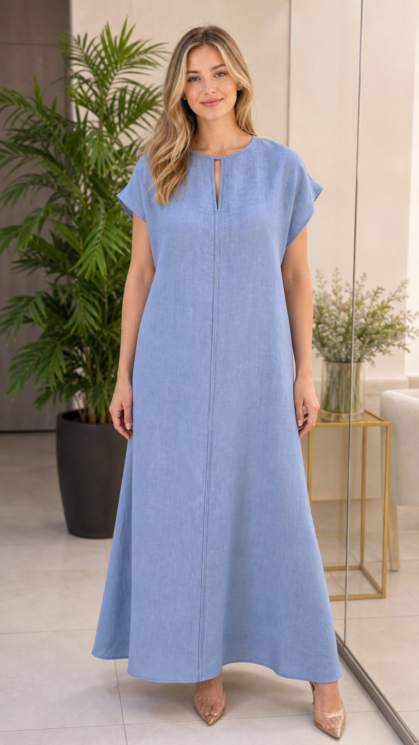 Front full-length view of woman wearing sky blue linen-look maxi dress