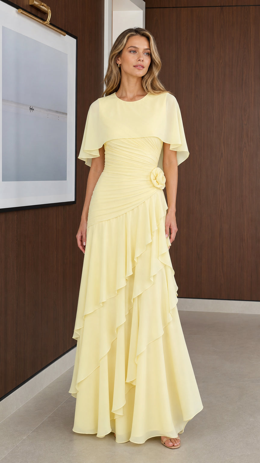 Front view of model wearing Pale Yellow capelet chiffon maxi dress with tiered ruffles