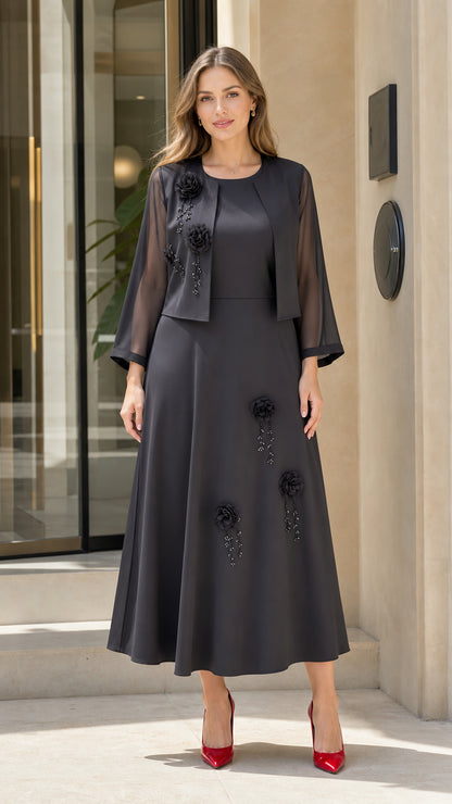 Front view of Charcoal Grey 2-piece formal maxi dress set with bolero jacket and floral appliqué