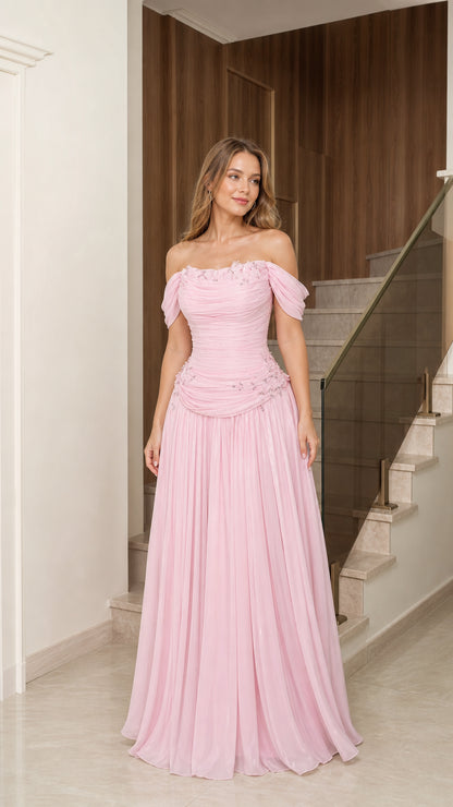 Front full-length view of woman wearing blush pink off-the-shoulder beaded evening gown