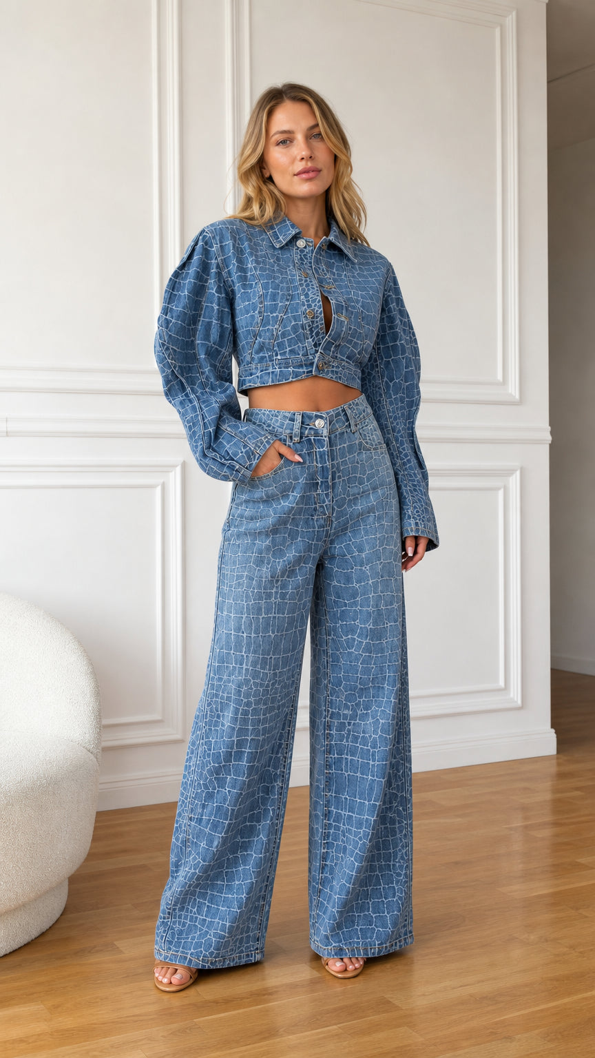 Front view of model wearing denim blue crocodile embossed cropped jacket and wide leg pants set