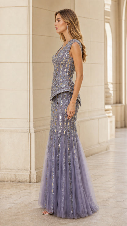 Side profile of woman in dusty blue beaded peplum floor-length formal dress