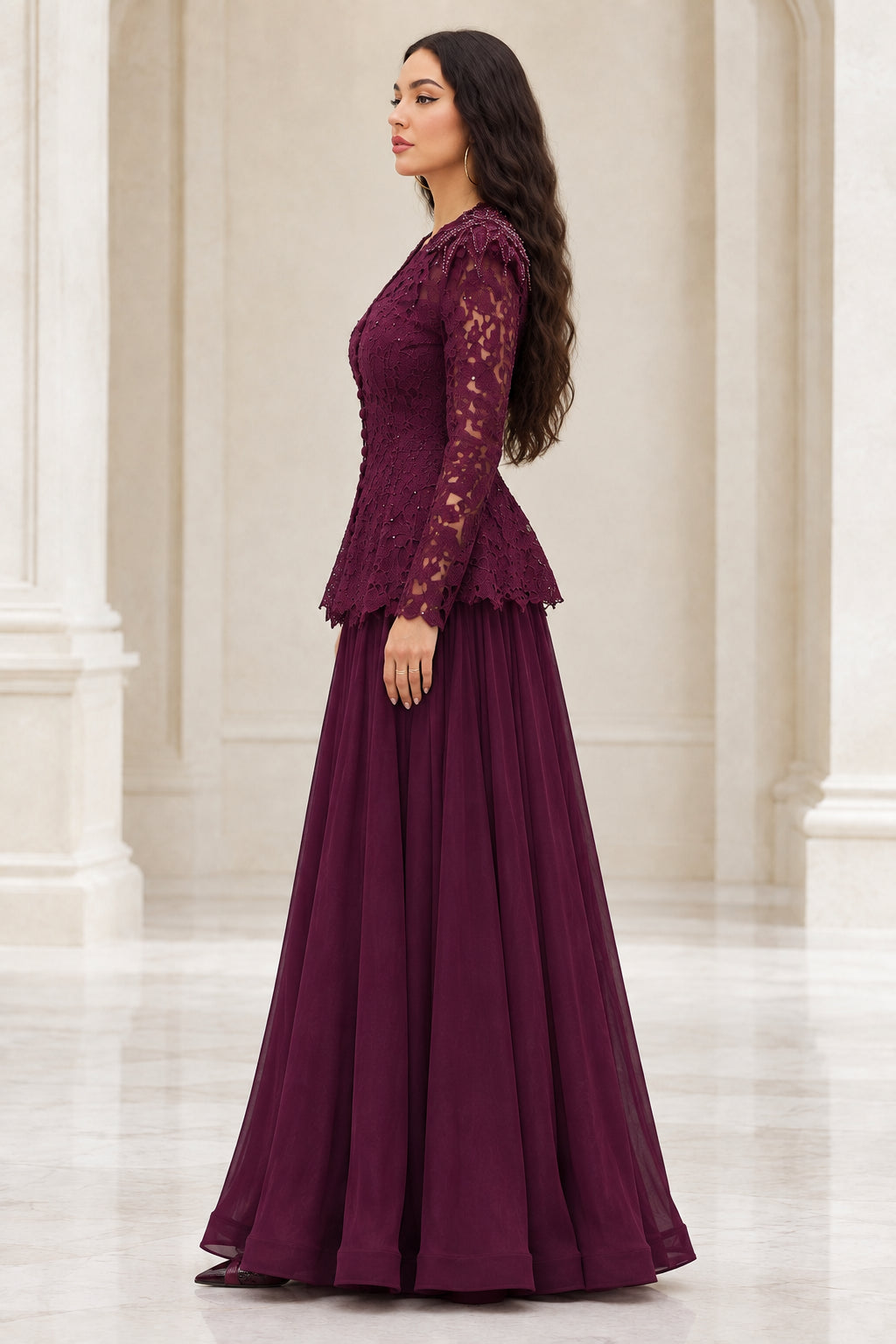 Side profile of burgundy long sleeve lace and chiffon evening gown