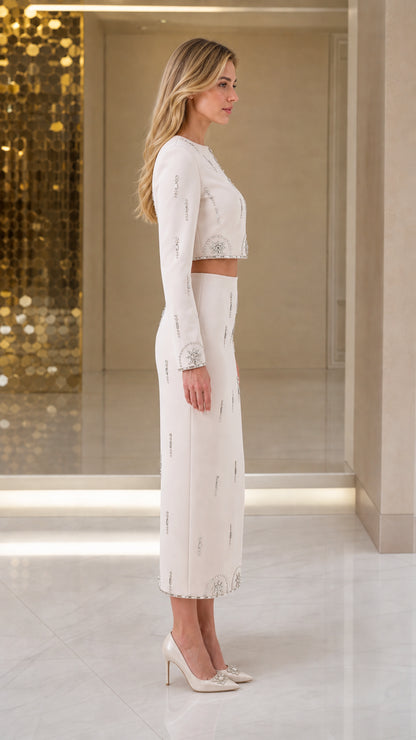 Side profile view of model in the Ivory crystal-trimmed two-piece midi set