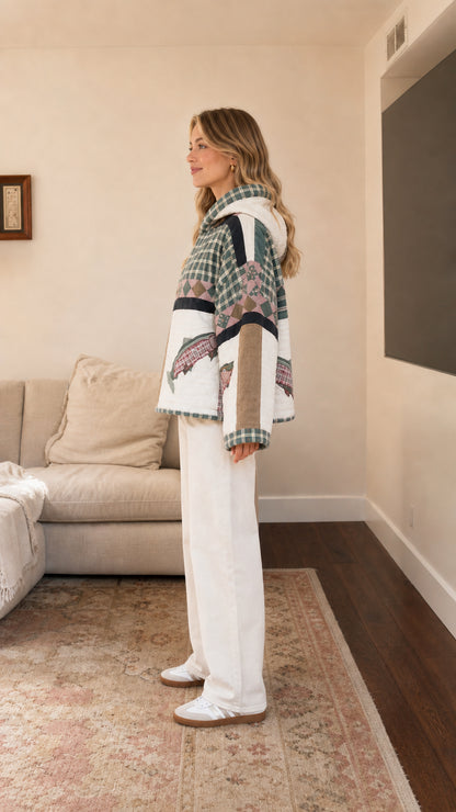 Side view of model wearing quilted patchwork hooded pullover in Sage Green
