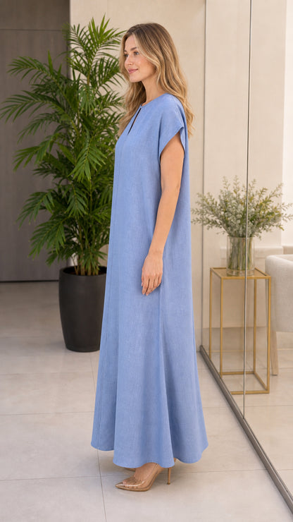 Side profile view of woman modeling sky blue casual maxi dress