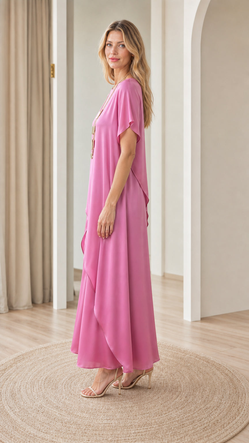 Side profile view of model wearing fuchsia pink matching tunic and palazzo pant set