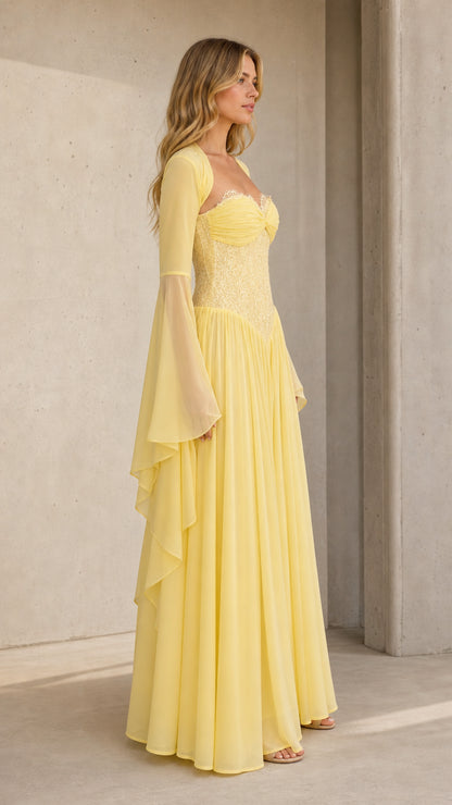 Three-quarter angle of model in pale yellow sweetheart evening gown with flared sleeves