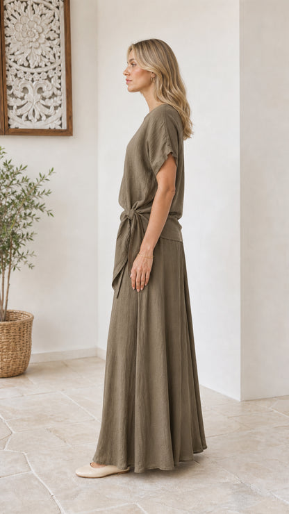 Side view of model in olive green relaxed two-piece pants set