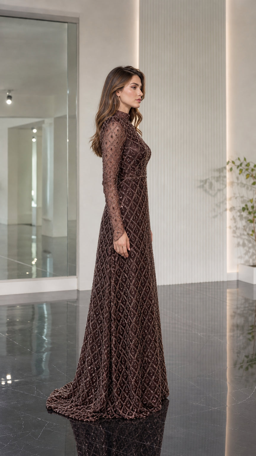 Side profile of model wearing chocolate brown beaded floor length formal gown