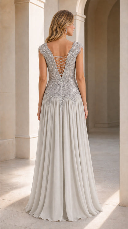 Back view of silver evening gown with deep V lace-up detail