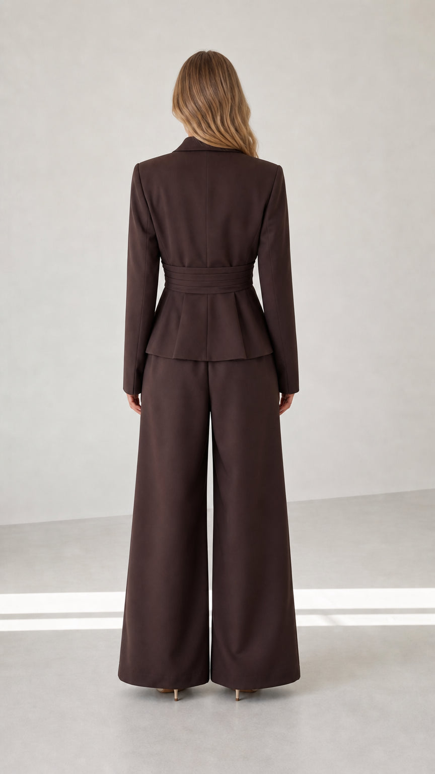 Back view of chocolate brown blazer and wide-leg trousers outfit