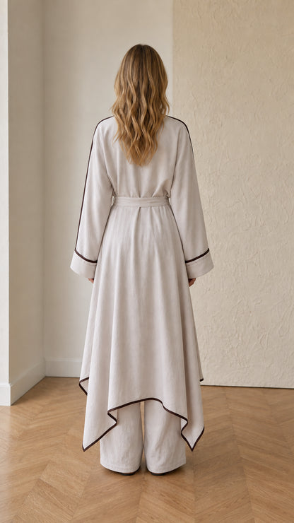 Back view of beige flowing tunic set with waist tie sash