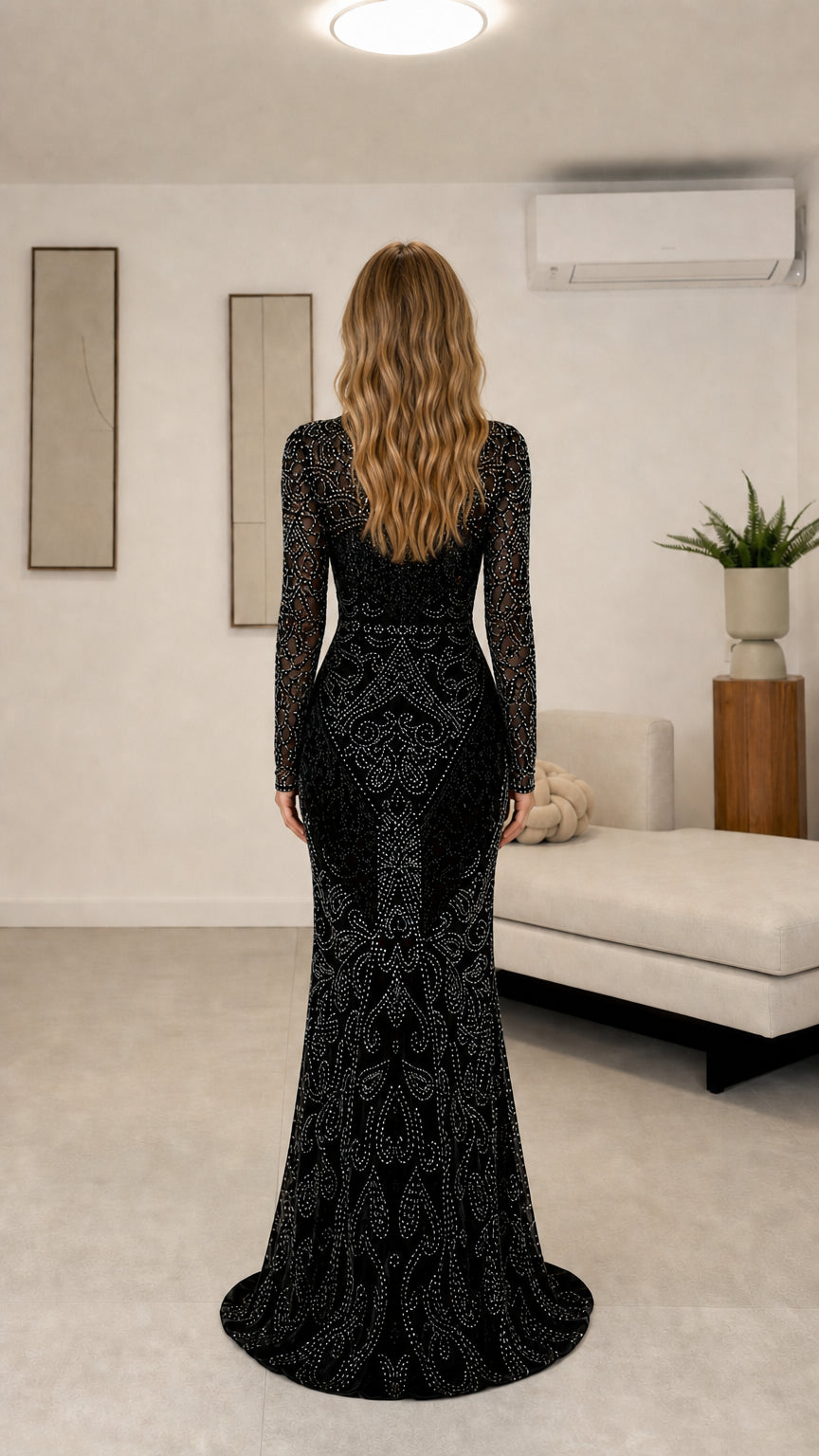 Back view of black long sleeve floor-length formal gown