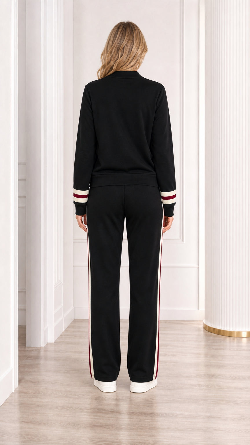 Back view of woman wearing black knit cardigan and pants set