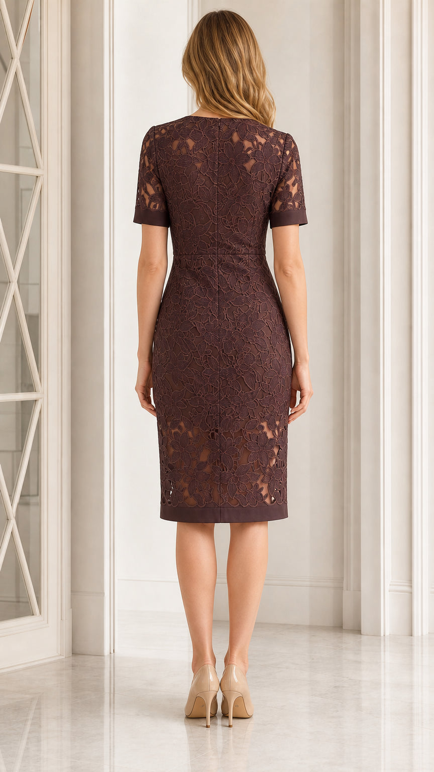 Back view of tailored plum lace sheath dress showing knee-length hem