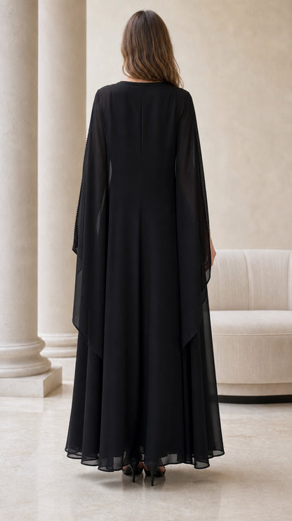 Back view of flowing black floor-length chiffon evening dress