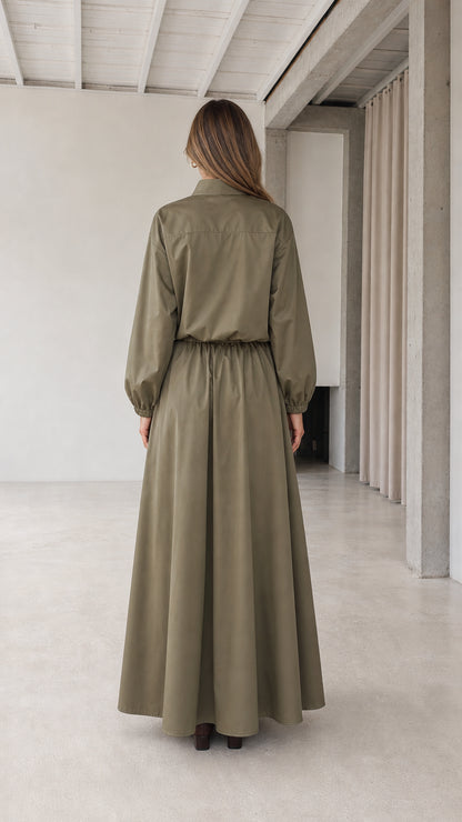 Back view of woman wearing olive green stand collar maxi dress