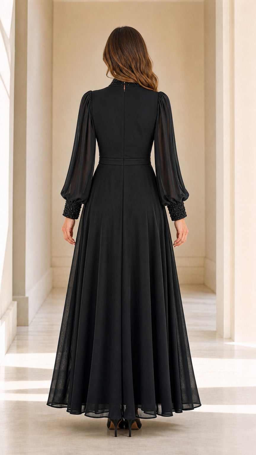 Back view of black floor length long sleeve evening maxi gown