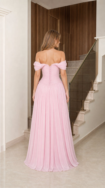 Back view of blush pink formal gown showcasing lace-up corset closure