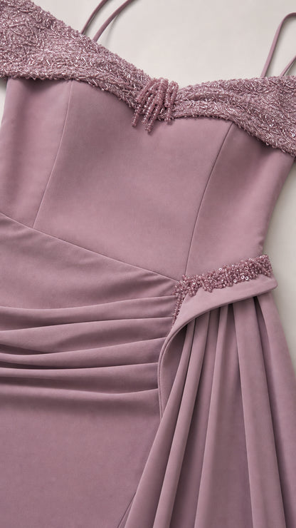 Close-up detail of beaded off-the-shoulder neckline and ruched waist trim