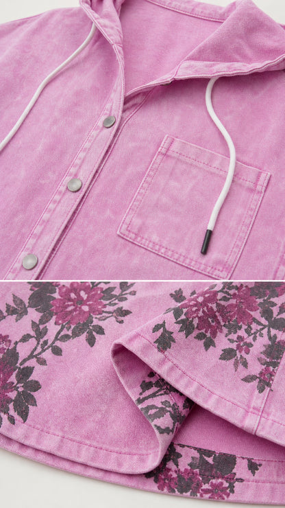 Close-up detail of the washed pink hood, snap buttons, chest pocket, and floral hem