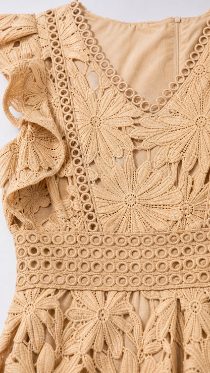 Close-up detail of beige floral lace pattern and waist ladder trim