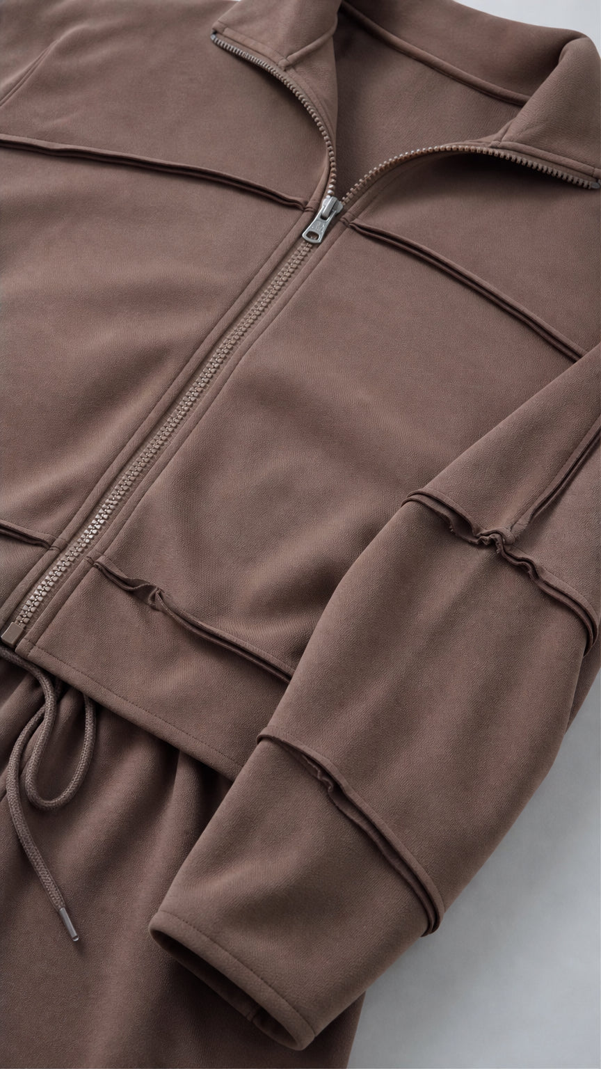 Close-up detail of Chocolate Brown zip-up jacket collar and exposed seam construction