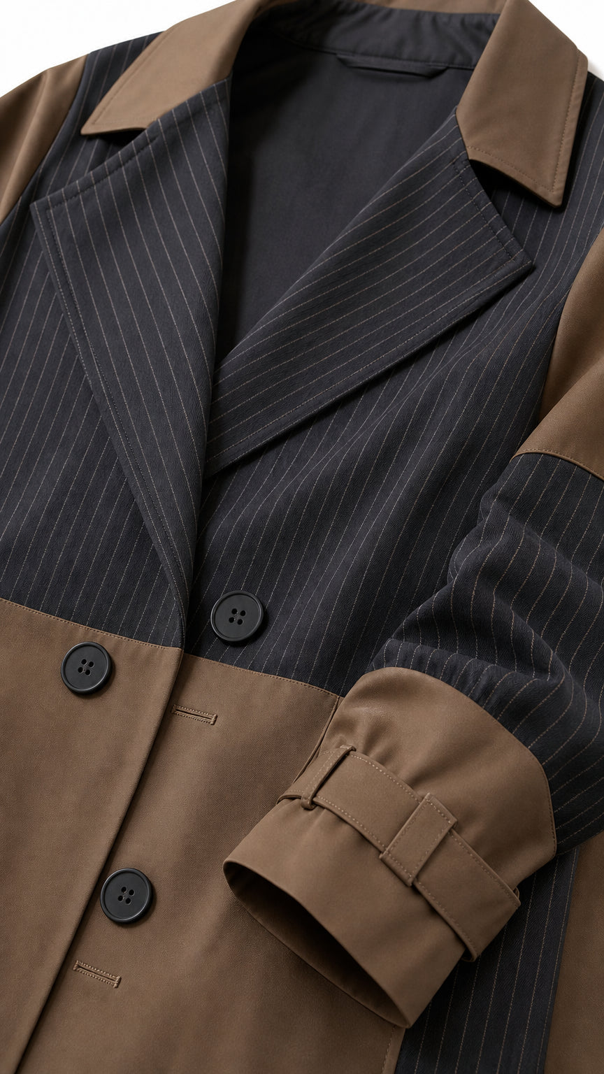 Close-up detail of lapel, buttons, and sleeve cuff on pinstripe colorblock trench coat