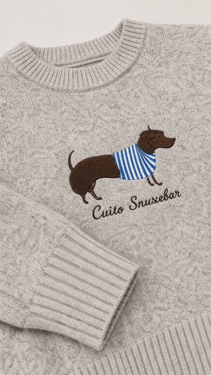 Close-up detail of embroidered dachshund dog wearing striped sweater on Heather Grey knit fabric