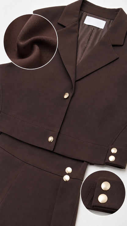 Close-up detail of brown fabric texture, notched lapel, and metallic button accents