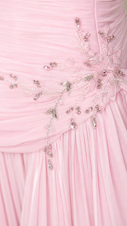 Close-up detail of crystal beadwork and ruched chiffon fabric