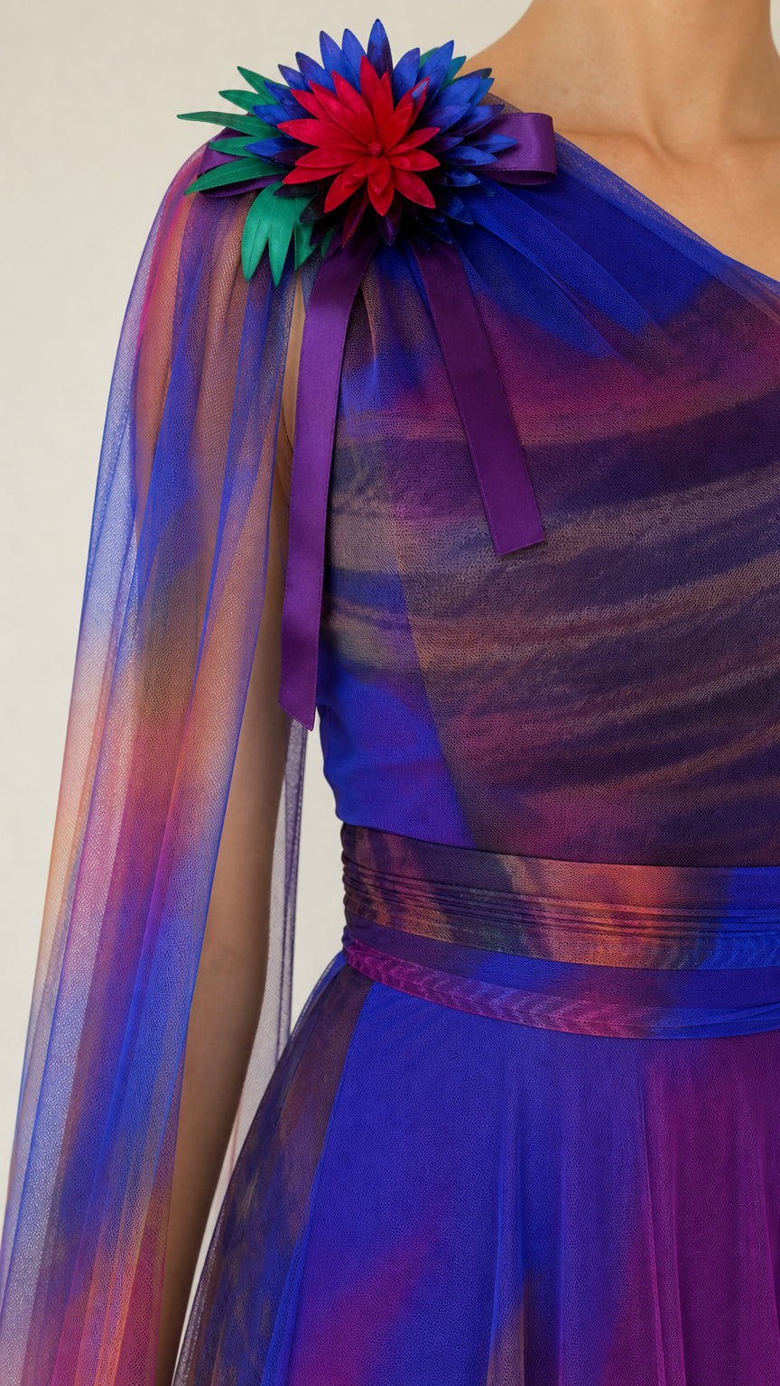 Close-up detail of 3D multicolor floral corsage on pleated one-shoulder bodice