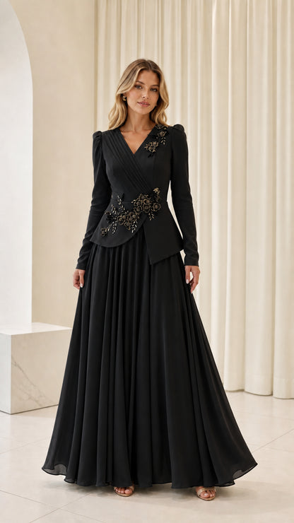 Front view of woman wearing black long sleeve floral beaded peplum evening maxi dress