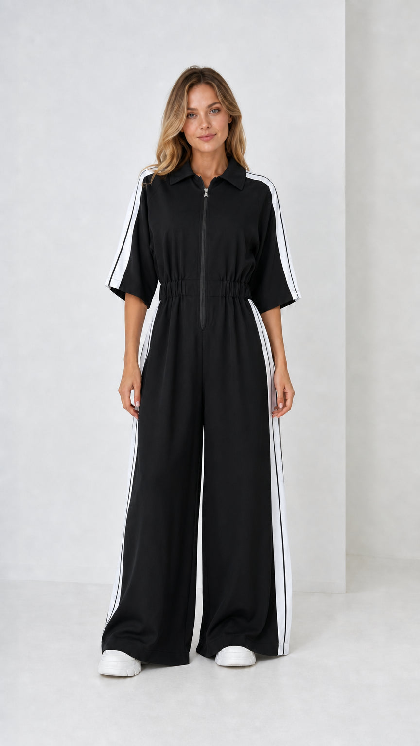 Black short sleeve wide leg track jumpsuit with contrast white stripes