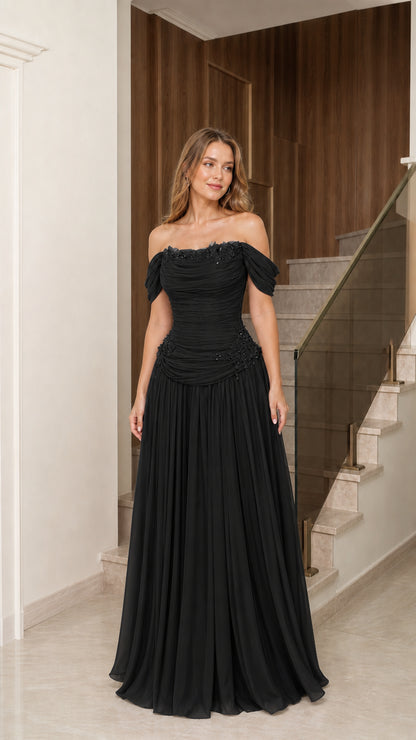 Front full-length view of black off-the-shoulder beaded evening gown