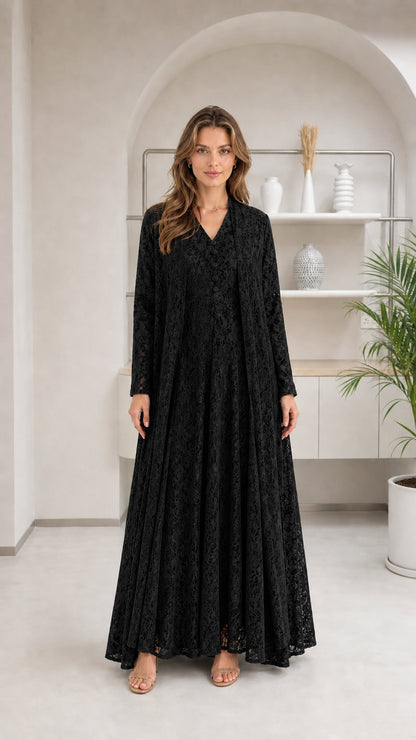 Front view of woman wearing black floral lace maxi dress set