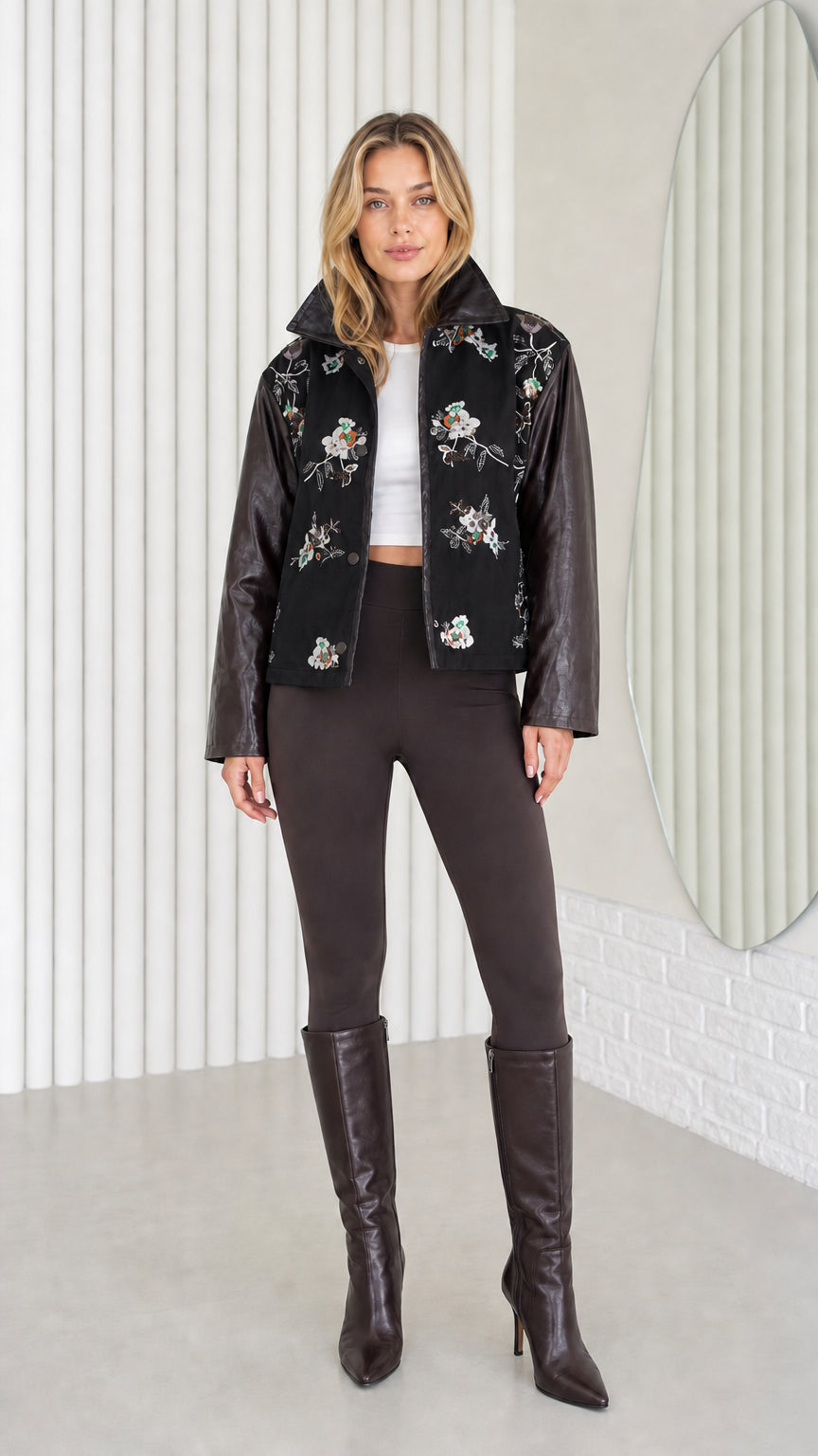 Model wearing Black embroidered jacket with contrast faux leather sleeves