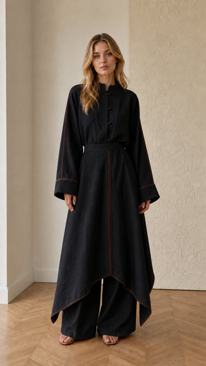 Full front view of black asymmetrical tunic and wide-leg pants two-piece set