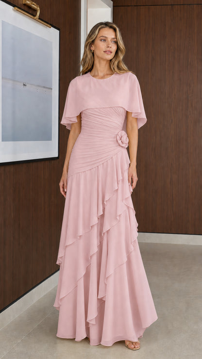 Model wearing Blush Pink capelet tiered ruffle evening gown