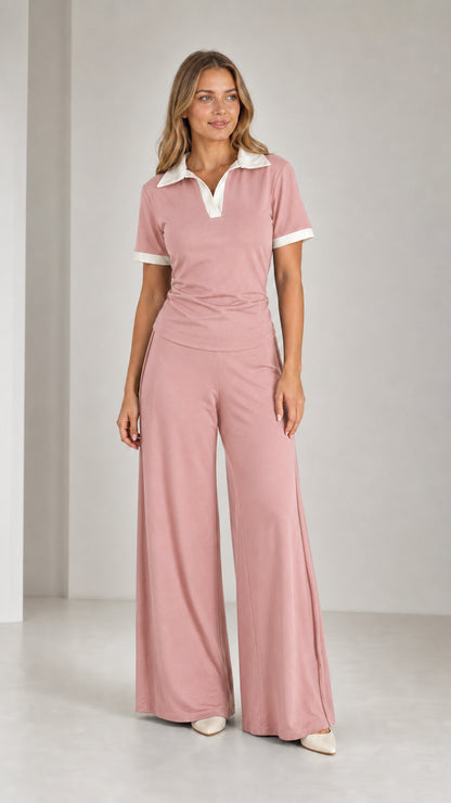 Model wearing Dusty Pink contrast collar polo top and relaxed wide-leg trousers