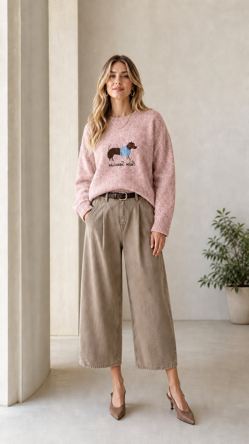 Model wearing Light Pink dachshund graphic crewneck knit sweater