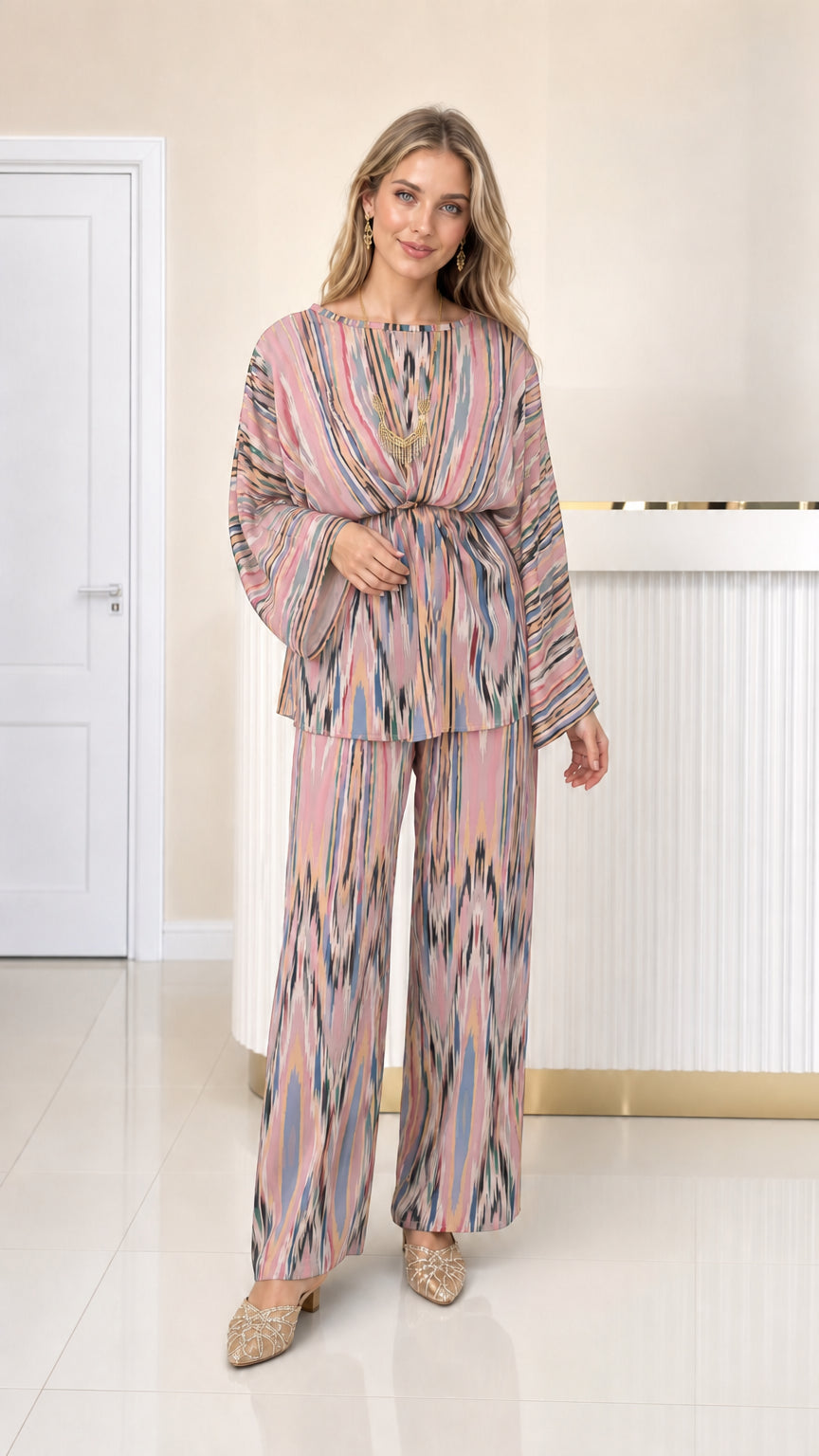 Front full view of woman wearing blush pink printed pleated co-ord set