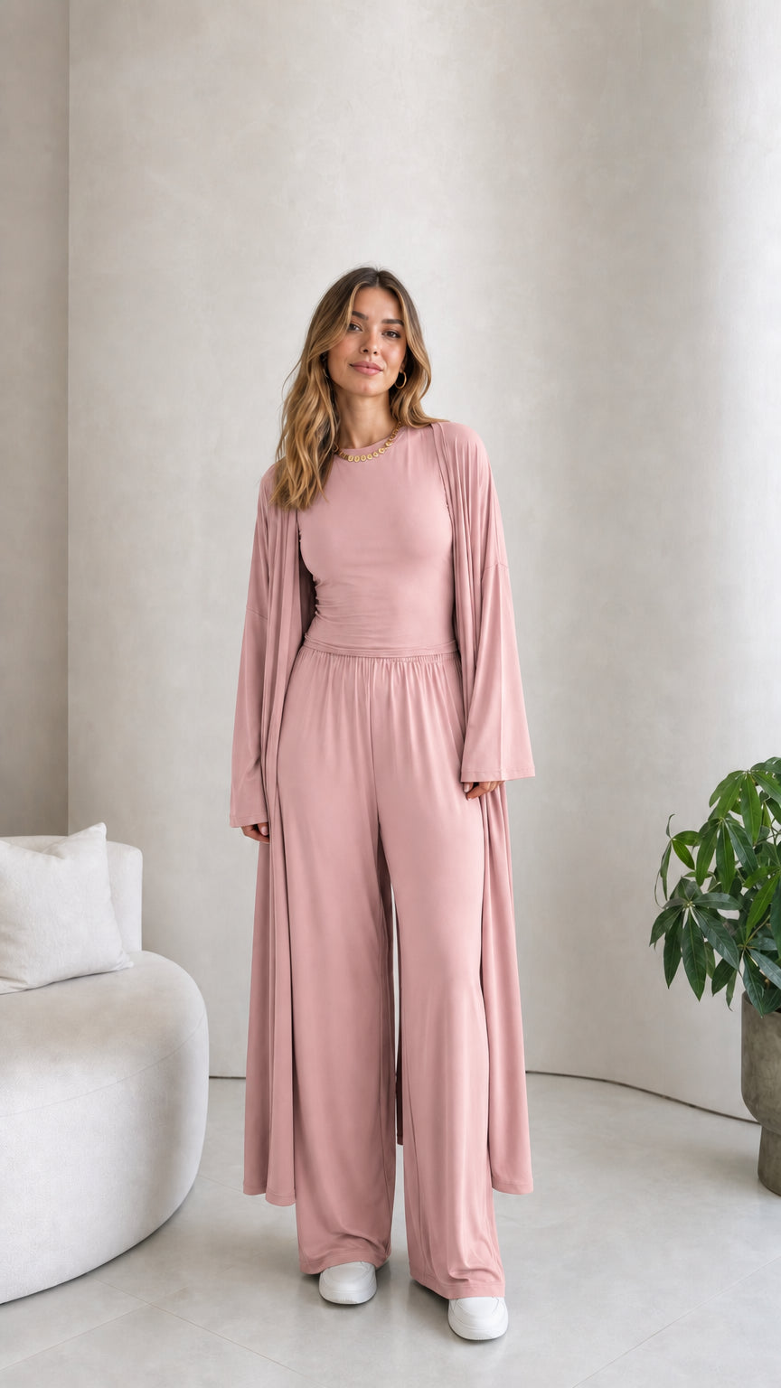 Front view of model wearing the 3-piece duster cardigan and pants set in dusty pink