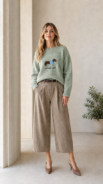 Model wearing Sage Green dachshund graphic crewneck knit sweater